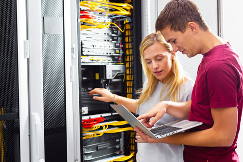 Two students setting up a server
