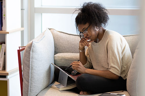 A woman working on a tablet