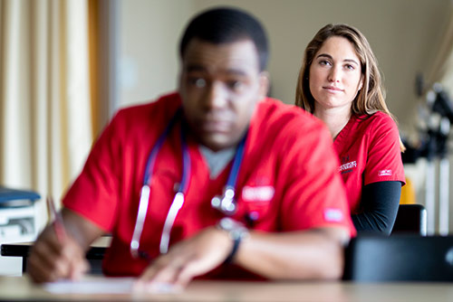 Two nursing students in class
