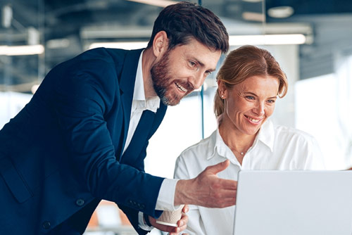 Two colleagues working at a computer
